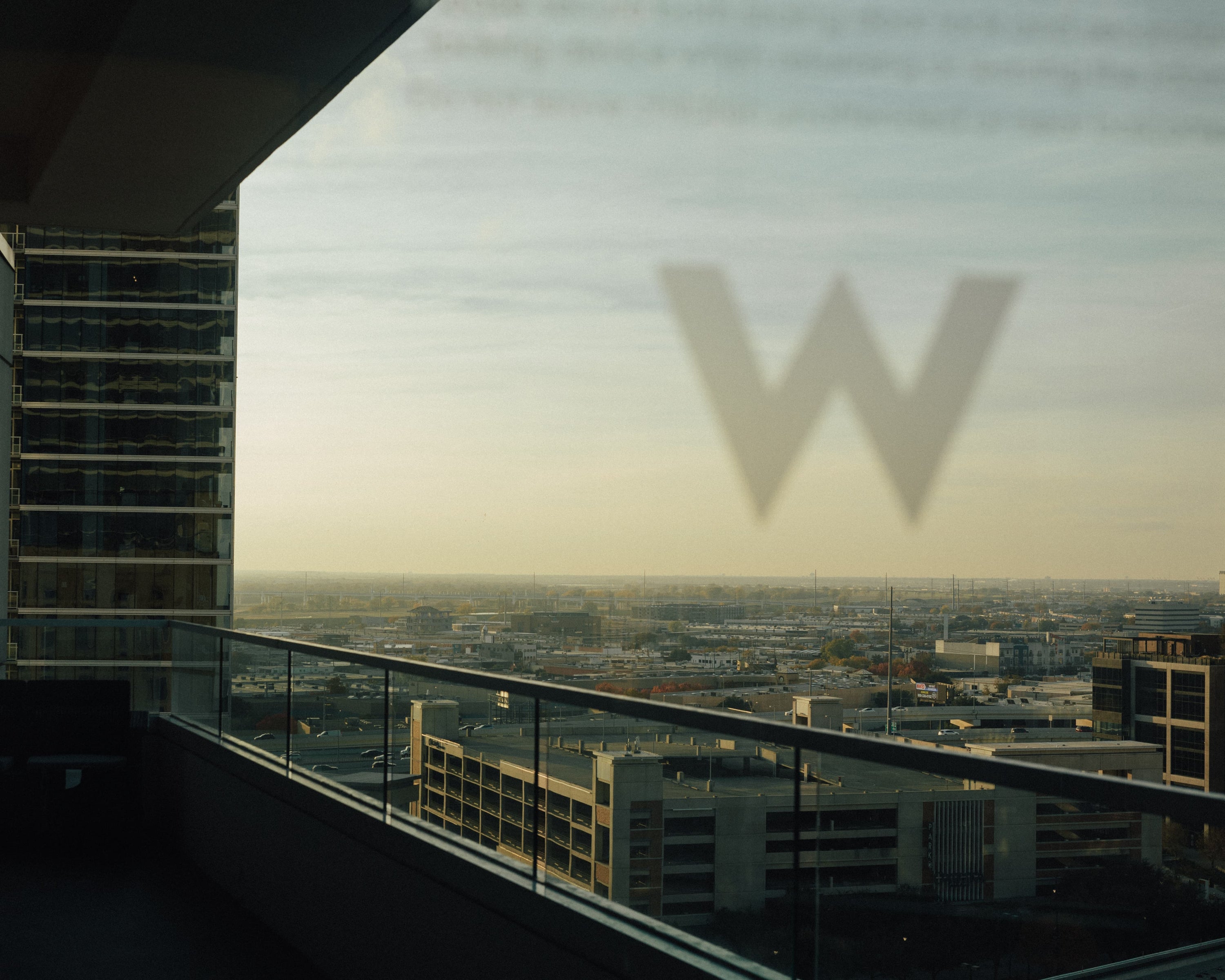 Visual work for W Hotel Dallas showing hotel view and logo.