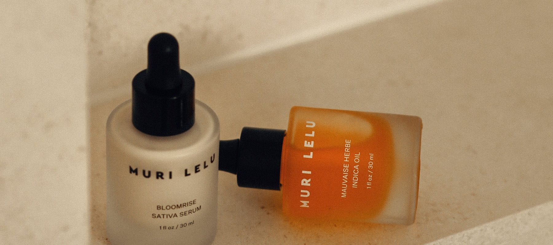 Bottles of Muri Lelu serum and face oil in the bathroom.